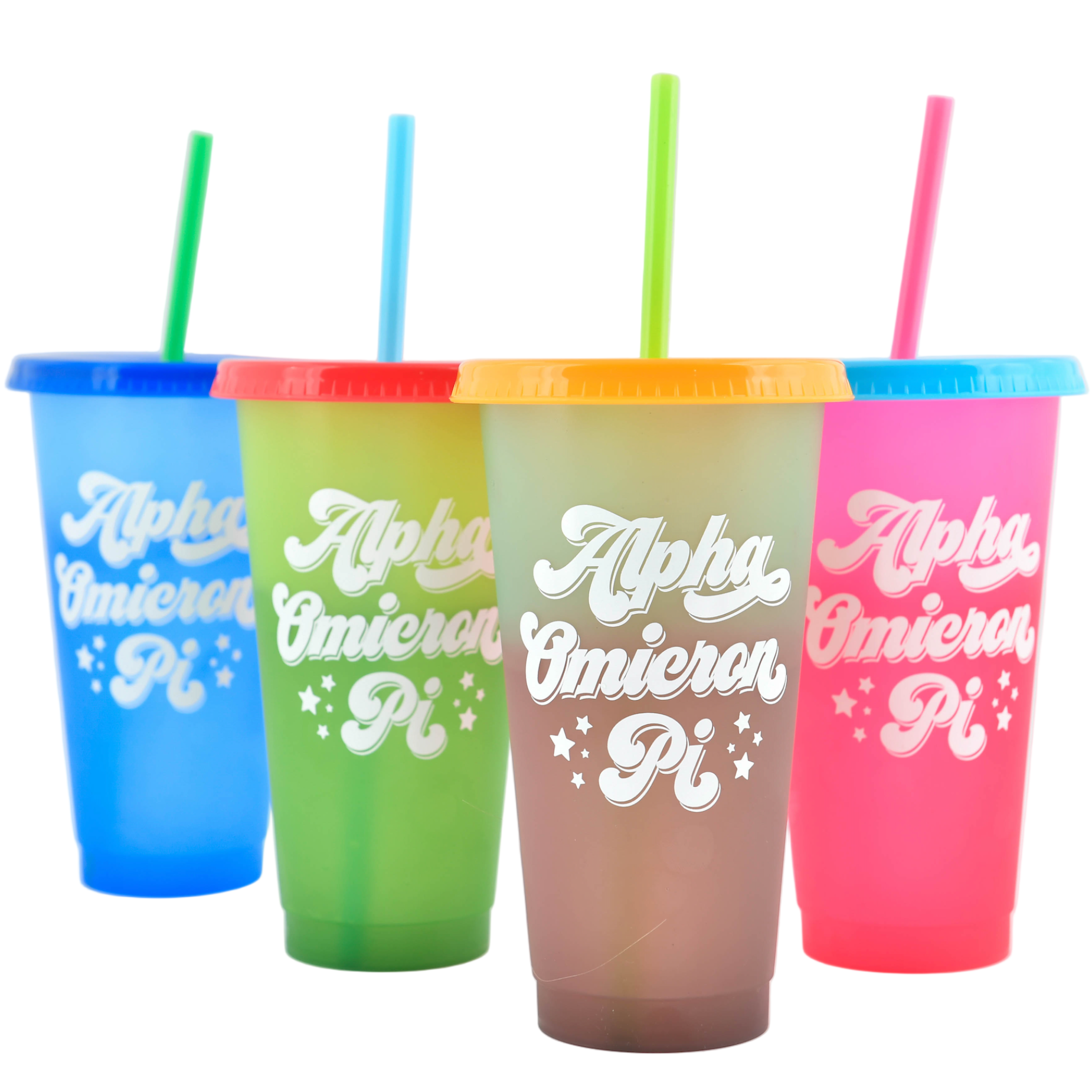 Four colorful tumblers with straws on a white background
