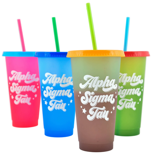 Four colorful tumblers with straws on a white background