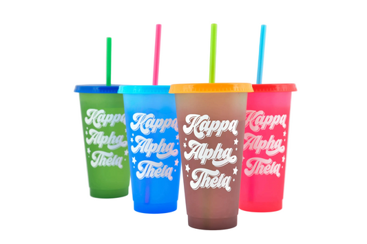 Four colorful tumblers with straws on a white background, featuring 'Kappa Alpha Theta' text.