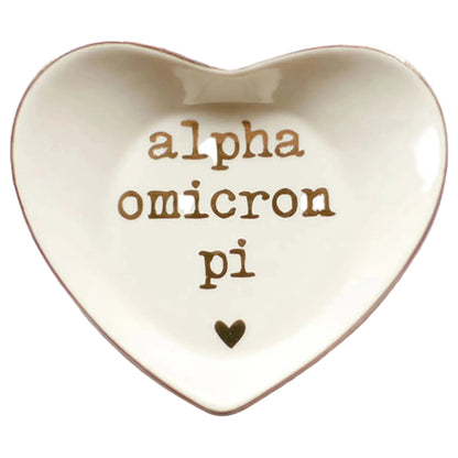 Heart-shaped ceramic dish with 'alpha omicron pi' text on a white background