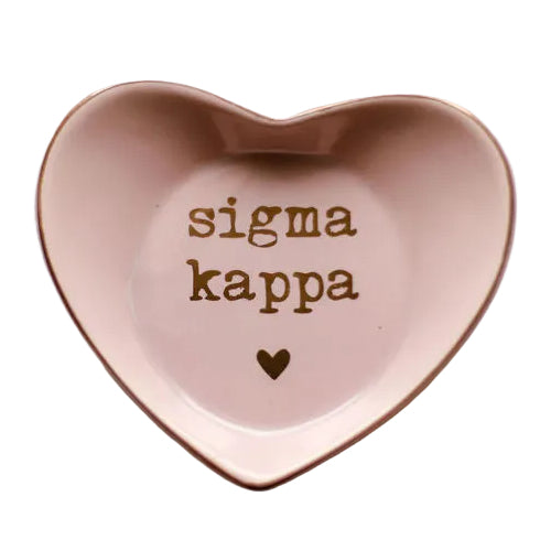 Heart-shaped pink dish with 'sigma kappa' text on a light gray background